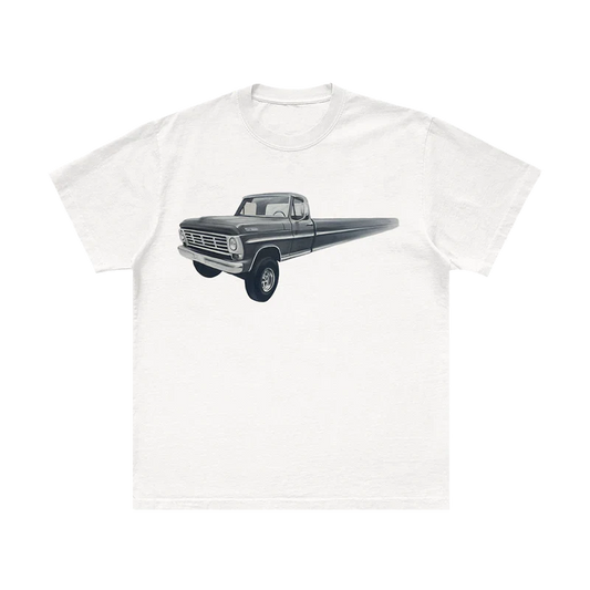 Post Malone Infinite Truck Painting T-Shirt front view featuring surreal elongated vintage pickup truck artwork inspired by the F-1 Trillion era, printed on a white premium cotton tee with western automotive aesthetics