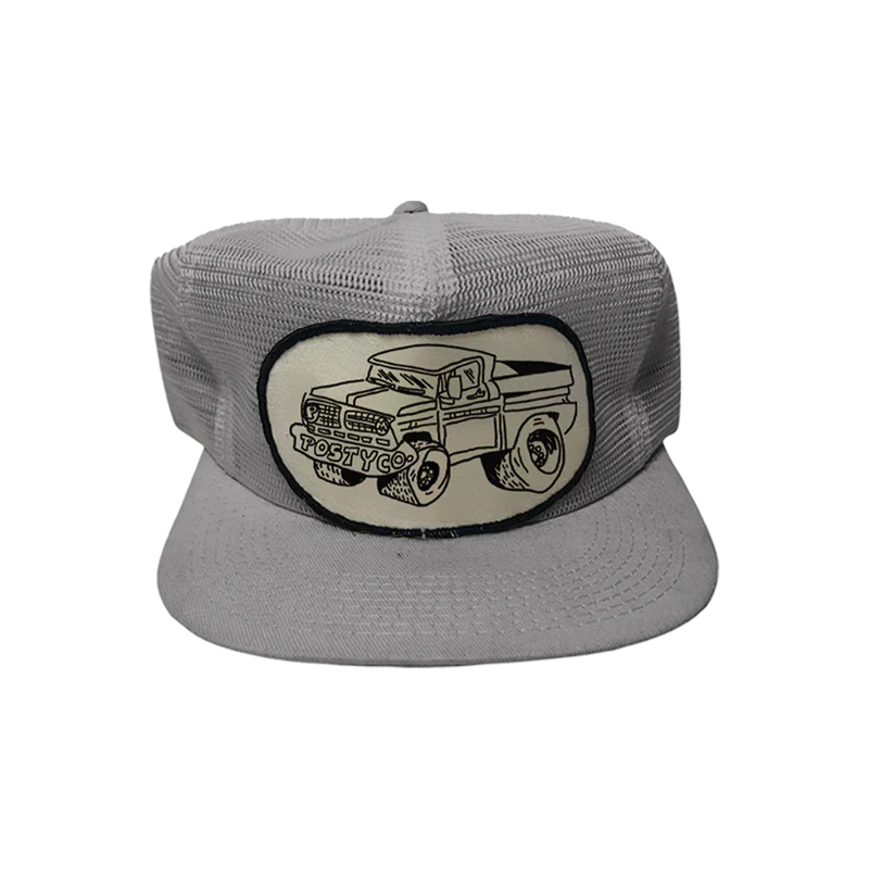 Mesh Trucker Hat front view in grey featuring vintage Posty Co pickup truck patch graphic breathable mesh construction flat brim design and classic Post Malone trucker cap style for everyday wear