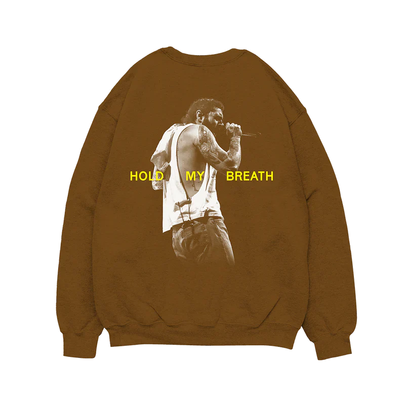 Post Malone Hold My Breath Crewneck front view featuring Austin album branding with yellow chest graphic on brown sweatshirt