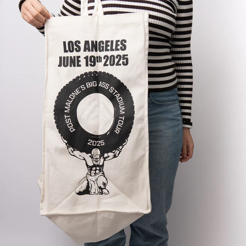Post Malone LA Big Ass Stadium Tour tote bag lifestyle view featuring tire graphic and Los Angeles June 19 2025 design