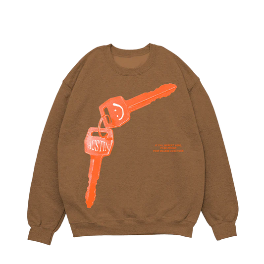 Post Malone Tan Keys Crewneck front view featuring oversized Austin key graphic artwork with 2023 tour inspired design on brown crewneck sweatshirt